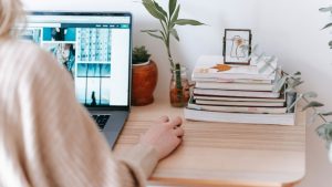 Remote worker sitting at their desk on laptop